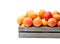 Fresh apricots on wooden box isolated on white