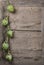 Fresh artichokes hanging over wooden table