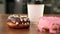 Fresh artisan donuts, take away coffee, wooden table background, tasty donut