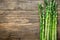 Fresh asparagus on wooden background