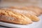 Fresh assortments of baguette breads on the table in the bakery in a selective focus