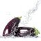 Fresh aubergine falling in water