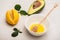 Fresh avocado, lemon, bowl with honey