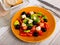 Fresh avocado salad on table with serving pieces