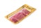 Fresh bacon is cut into thin slices in a vacuum package and isolated on a white background