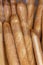 Fresh baguettes in the package on the counter in the store. Close-up.