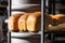 Fresh baked artisan bread on a shelf in bakery shop. Gourmet breads for sale