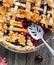 Fresh baked autumn themed lattice cherry pie with server and one slice removed.