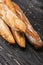 Fresh baked baguette loaves on wooden