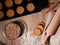 Fresh baked cookies on baking tray. Dough roll and scattered flour.