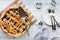 A fresh baked lattice cherry pie with pie server and plates, ready for serving.