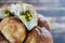 Fresh baked pasties filled with green onion and egg on a wooden background, closeup. Ukrainian national dish