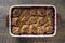 Fresh baked raspberries cobbler in a baking dish. Homemade berry cobbler, closeup