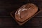 Fresh baked sliced bread on rustic wooden table