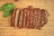 Fresh baked sliced meatloaf on a cutting board