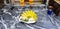 Fresh banana, small glass of water and betel nut in white dish on black marble table