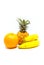 Fresh bananas baby pineapple and orange on white healthy live concept