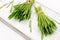 Fresh barley grass on a white wooden table