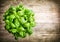 Fresh basil bunch on wooden table