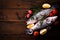 Fresh bass fish on wooden background