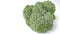 Fresh beautiful green broccoli on a white background. Vegetarian diet. Ripe healthy vegetable containing vitamins and minerals.