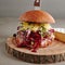 Fresh Beef Burger with Sweet Cranberry Sauce, Green Sprouts and Cheese