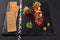 Fresh beef tartar with salt and herbs and Crispbread, studio shot. Meat tartar on black shale. On white background