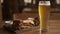 Fresh beer snacks assortment and glass of beer. beer plate in the cafe. blurred background