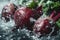 Fresh beetroots with glistening water droplets on a wet dark surface