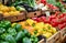 Fresh Bell Peppers Displayed in Wooden Crates at a Local Farmers Market