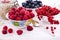 Fresh berries raspberries, yogurt and homemade granola for breakfast, top view, horizontal