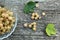 Fresh berries of white currant lie on a glass plate and are scattered near it.