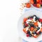 fresh berries, yogurt and granola for breakfast