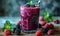 Fresh Berry Smoothie in a Tall Glass with a Striped Straw, Vibrant Purple Drink Accompanied by Blackberries on a Light Blue