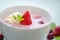 Fresh berry soup with strawberry, mint leaf and cream