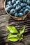 Fresh bilberries in vintage metal bowl