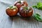 Fresh Black Brandywine Organic Tomatoes and basil on a wooden table.