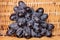 Fresh black wine grape with braided rattan