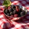 Fresh Blackberries in Metallic Bowl on Checkered Tablecloth