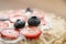 Fresh blinis or crepes with fresh berries and cream