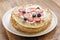 Fresh blinis or crepes with fresh berries and cream