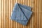Fresh blue towel on bamboo background