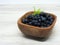 Fresh blueberries. Bowl of freshly picked organic blueberries on rustic wooden background