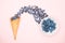 Fresh blueberries in ice cream cone on a pink background. Blueberry Blast. Summer vacation concept. Flat lay, top view. The style