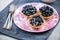 Fresh blueberry tart on vibrant plate