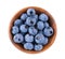 Fresh blueberry in wooden bowl, isolated on white background. Bilberry or whortleberry. Clipping path. Top view.