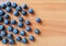 Fresh blueberry on a wooden table. Top view. Fresh bilberry closeup.