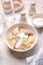 Fresh boiled dumplings in a light plate on a light background.