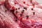 fresh boneless raw pork meat with salt and pepper like background, close up