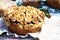 Fresh bread garnished with baked flowers and foliage on a festive towel, close-up